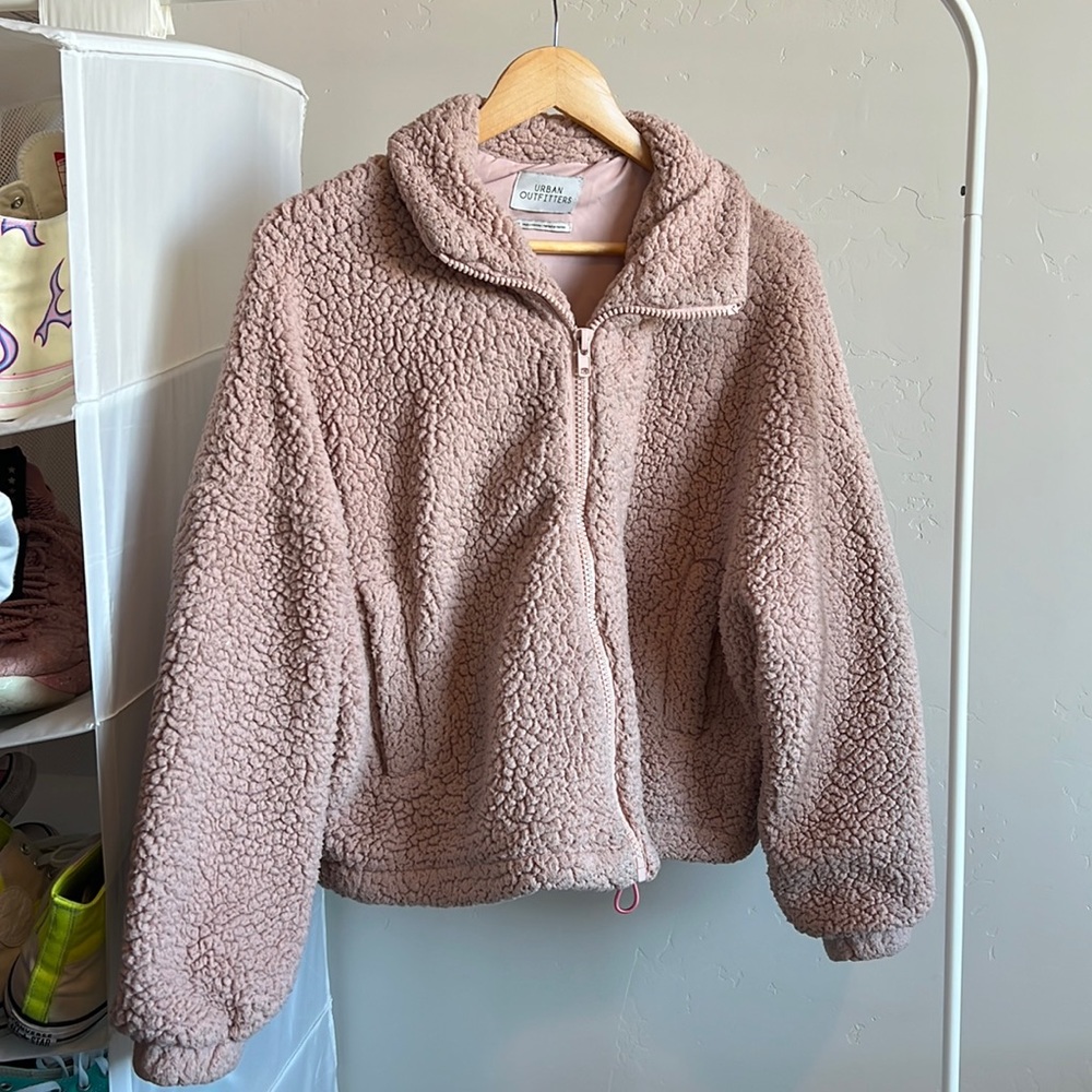Urban Outfitters pink teddy bear coat. Size Medium. Condition: Used.